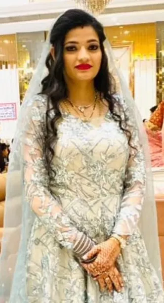 Bridal makeup look in white embellished gown