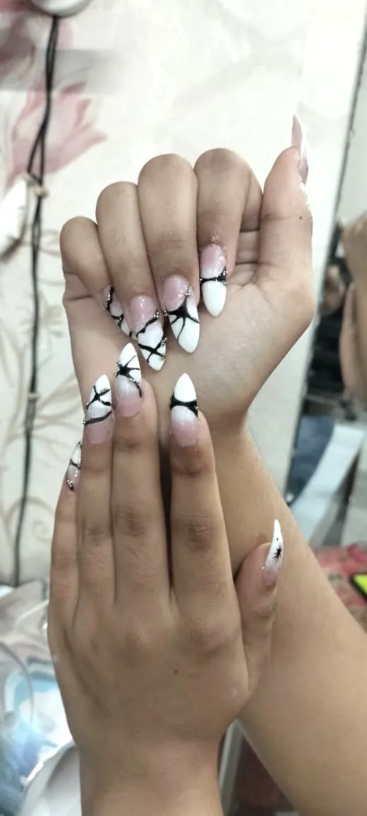 Stiletto nail art with hand-painted detail
